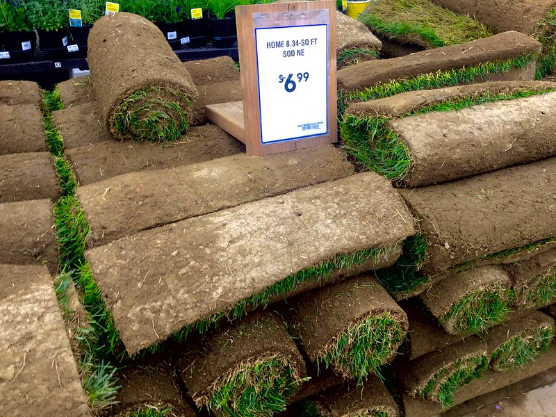 Stack of rolled-up sod in a store