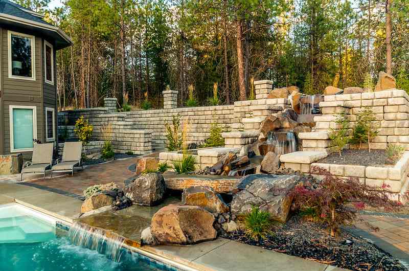 Backyard hardscaping with rocks and retaining walls