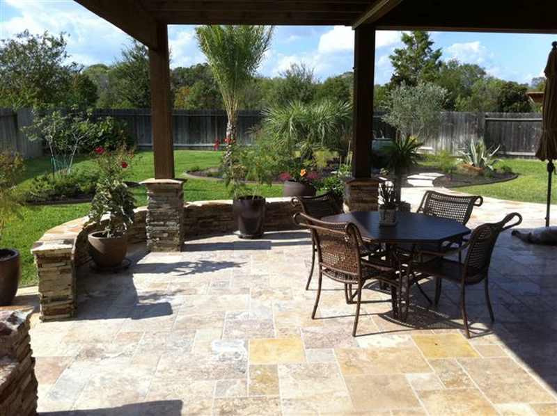 A view of a patio and backyard landscaping in the background in Texas
