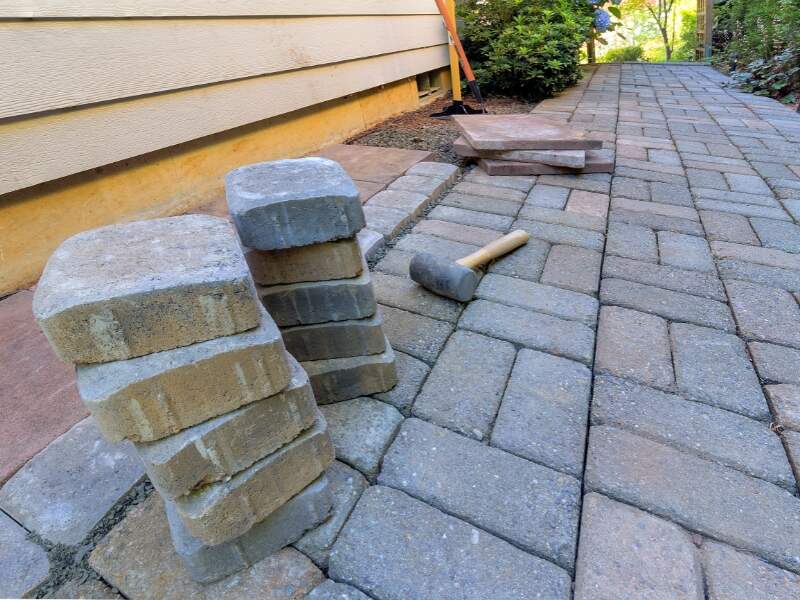 Installing pavers for a hardscape walkway