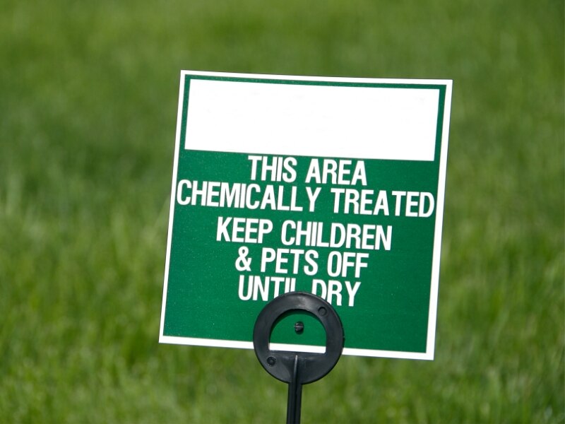 caution sign for chemically treated lawn