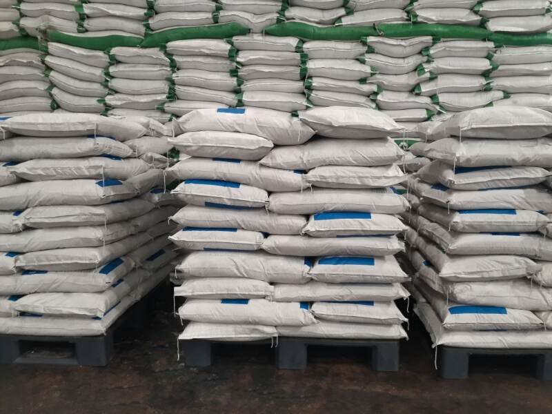 bags of fertilizer stacked in a warehouse